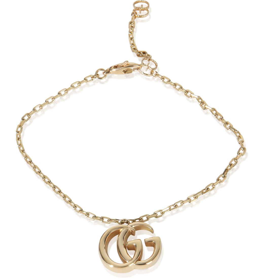 GG Marmont Charm Bracelet in 18k Yellow Gold by Gucci 7 Inch: GG Marmont Charm Bracelet in 18k Yellow Gold by Gucci 7 Inch This Gucci GG Marmont Charm bracelet is crafted from 18k yellow gold and features a lobster claw clasp. Designed for women, this pre-owned 