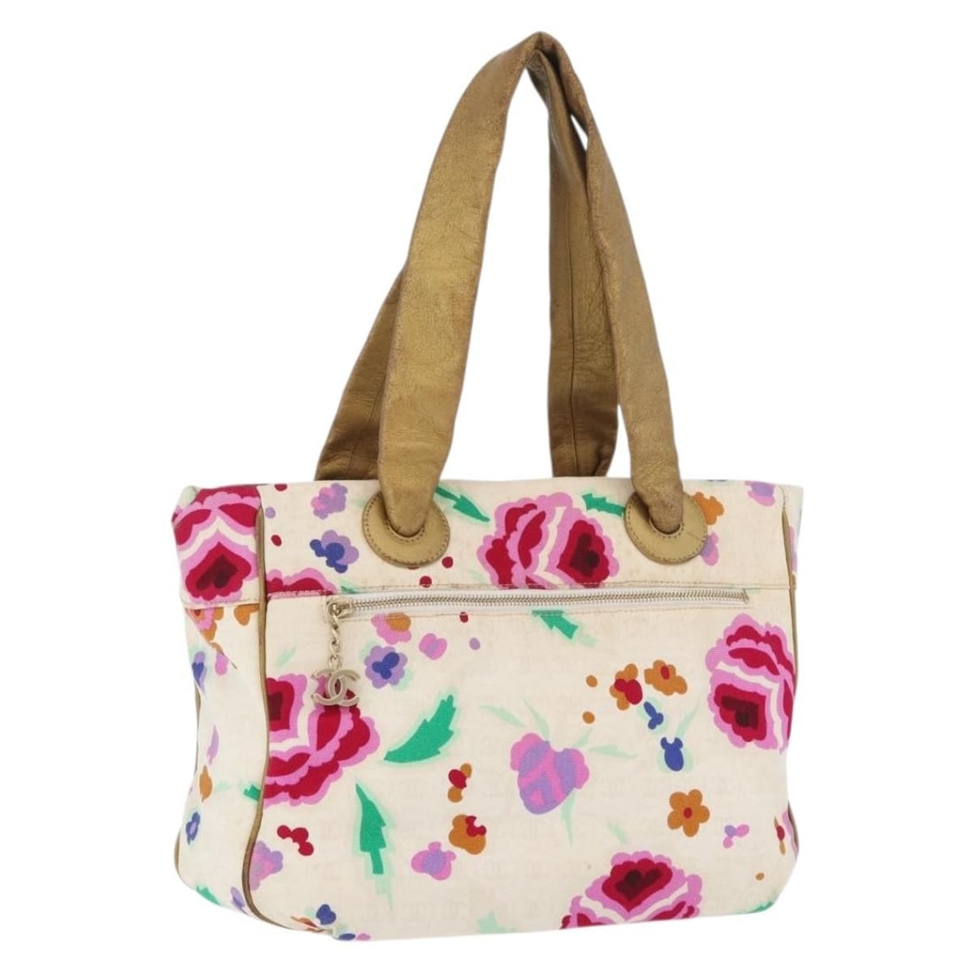 Ivory and Gold Canvas CHANEL Handbag with CC Logo: Ivory and Gold Canvas CHANEL Handbag with CC Logo This CHANEL handbag features an ivory and gold canvas exterior, designed specifically for women. The bag is crafted in Italy and includes dual handles