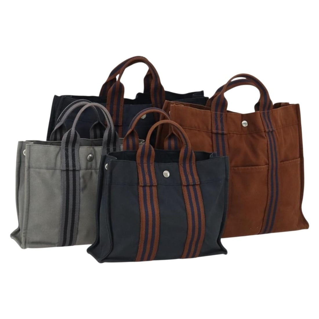 Set of 4 Hermes Fourre Tout Canvas Handbags in Black Navy and Gray: Set of 4 Hermes Fourre Tout Canvas Handbags in Black Navy and Gray This is a Hermes Fourre Tout hand bag set made from canvas in black, navy, and gray. The set is made in France and does not include a