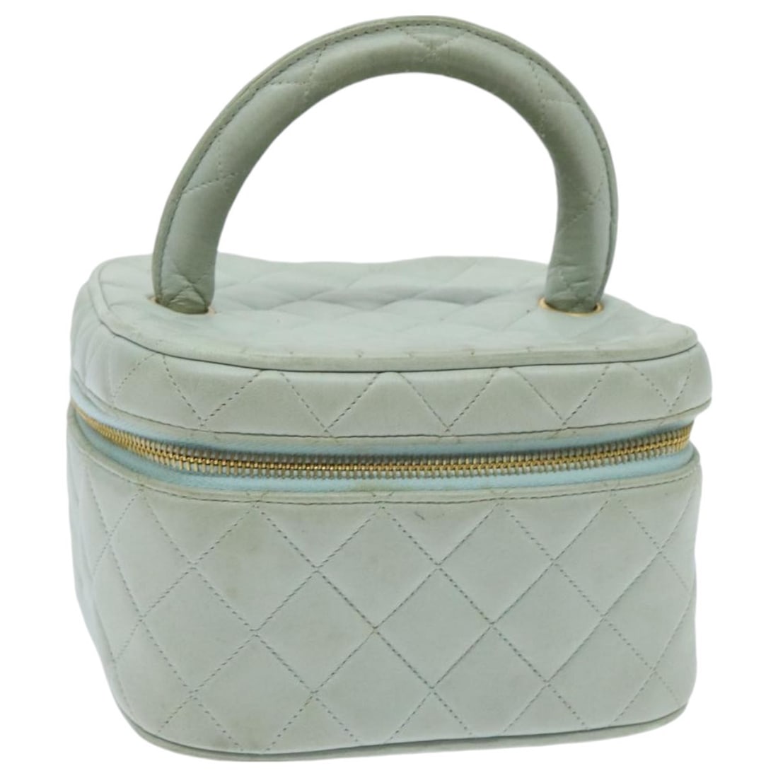 Chanel Blue Lambskin Matelasse Vanity Pouch with Gold Tone CC Logo: Chanel Blue Lambskin Matelasse Vanity Pouch with Gold Tone CC Logo This CHANEL Matelasse Vanity Cosmetic Pouch is crafted from luxurious lambskin leather in a blue and gold color combination. Designed