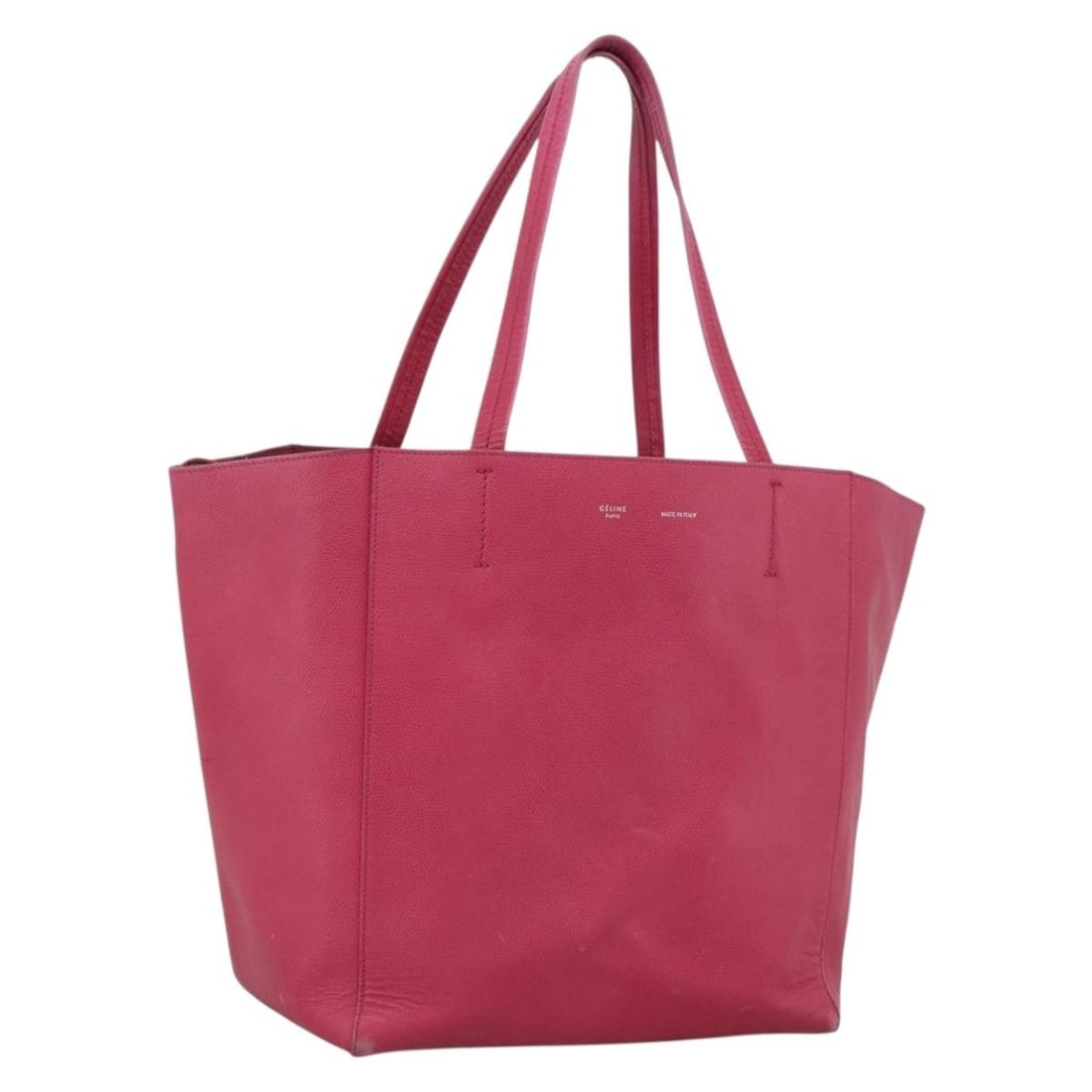 Leather tote bag CELINE Cabas Phantom pink gold tone: Leather tote bag CELINE Cabas Phantom pink gold tone A CELINE Cabas Phantom tote bag in pink leather with gold-tone hardware. It has a tote bag style and was made in Italy. The bag is heavily used and