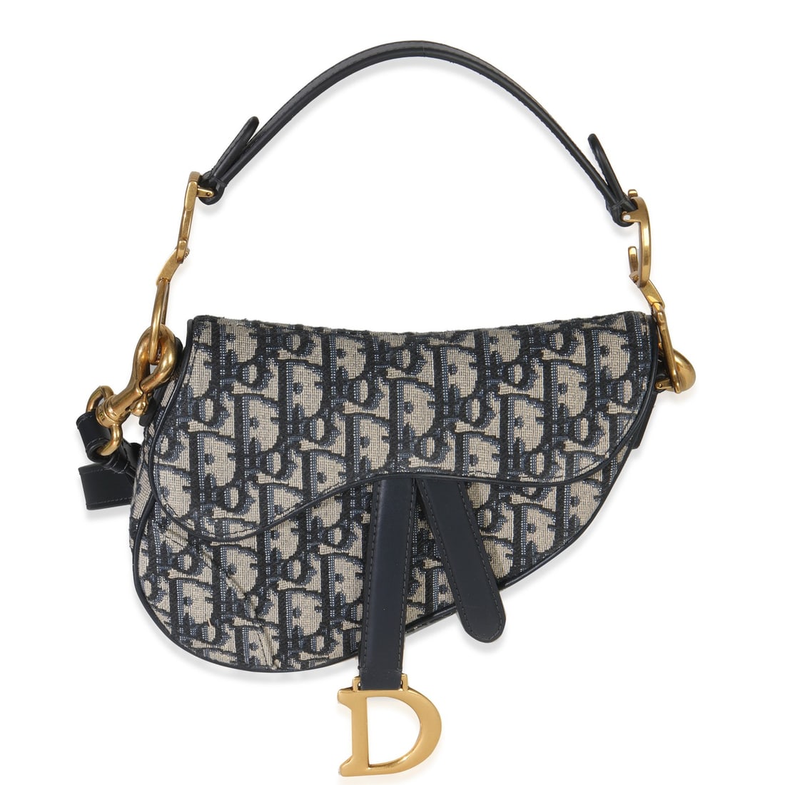 Christian Dior Saddle Mini Crossbody Top Handle Bag Blue Oblique Canvas: Christian Dior Saddle Mini Crossbody Top Handle Bag Blue Oblique Canvas A pre-owned blue oblique canvas mini saddle bag in a crossbody and top-handle style. It features a magnetic snap closure, gold-t