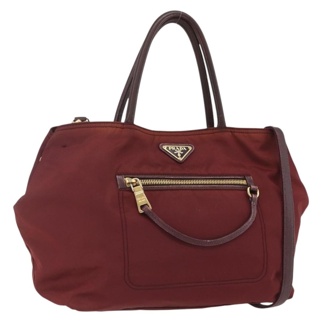 Prada Bordeaux Nylon 2way Handbag with Shoulder Strap Gold Tone: Prada Bordeaux Nylon 2way Handbag with Shoulder Strap Gold Tone This Prada hand bag is crafted from nylon in a bordeaux and gold color combination. It comes with a shoulder strap and is a 2-way style,