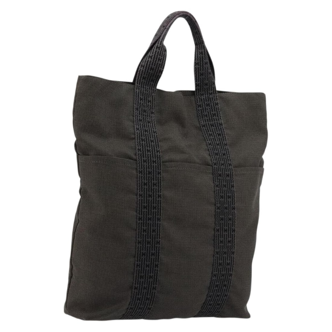 Hermes Her Line Canvas Gray Silver Tote Bag Auth: Hermes Her Line Canvas Gray Silver Tote Bag Auth This HERMES Her Line Cabas tote bag is crafted from canvas in a gray and silver color scheme. Designed for women, it features a spacious interior with 