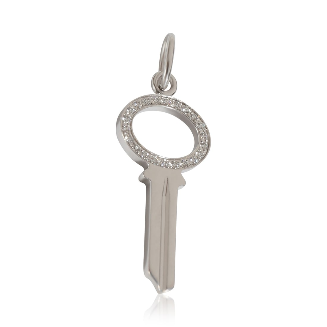 Tiffany & Co. Keys Mini Key Pendant 18k White Gold Diamond 0.05 CTW: Tiffany & Co. Keys Mini Key Pendant 18k White Gold Diamond 0.05 CTW A pre-owned unisex fashion pendant from the Keys collection, featuring a modern mini key design in 18k white gold. It includes a dia