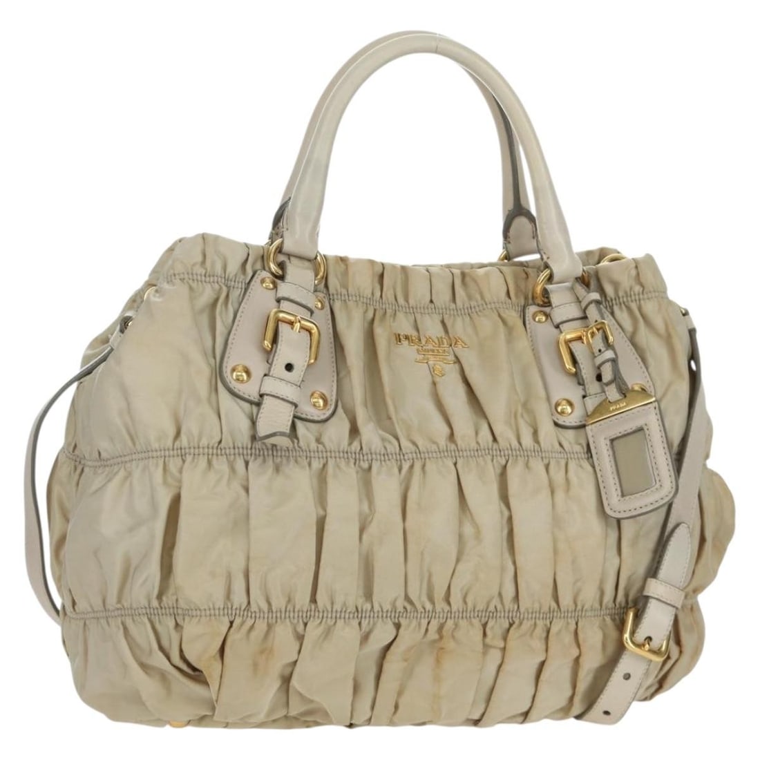 PRADA BA11812A 2way nylon handbag beige with shoulder strap: PRADA BA11812A 2way nylon handbag beige with shoulder strap A PRADA gathered handbag in beige and gold, crafted from nylon and designed as a 2-way style. It comes with a name tag and shoulder strap, a