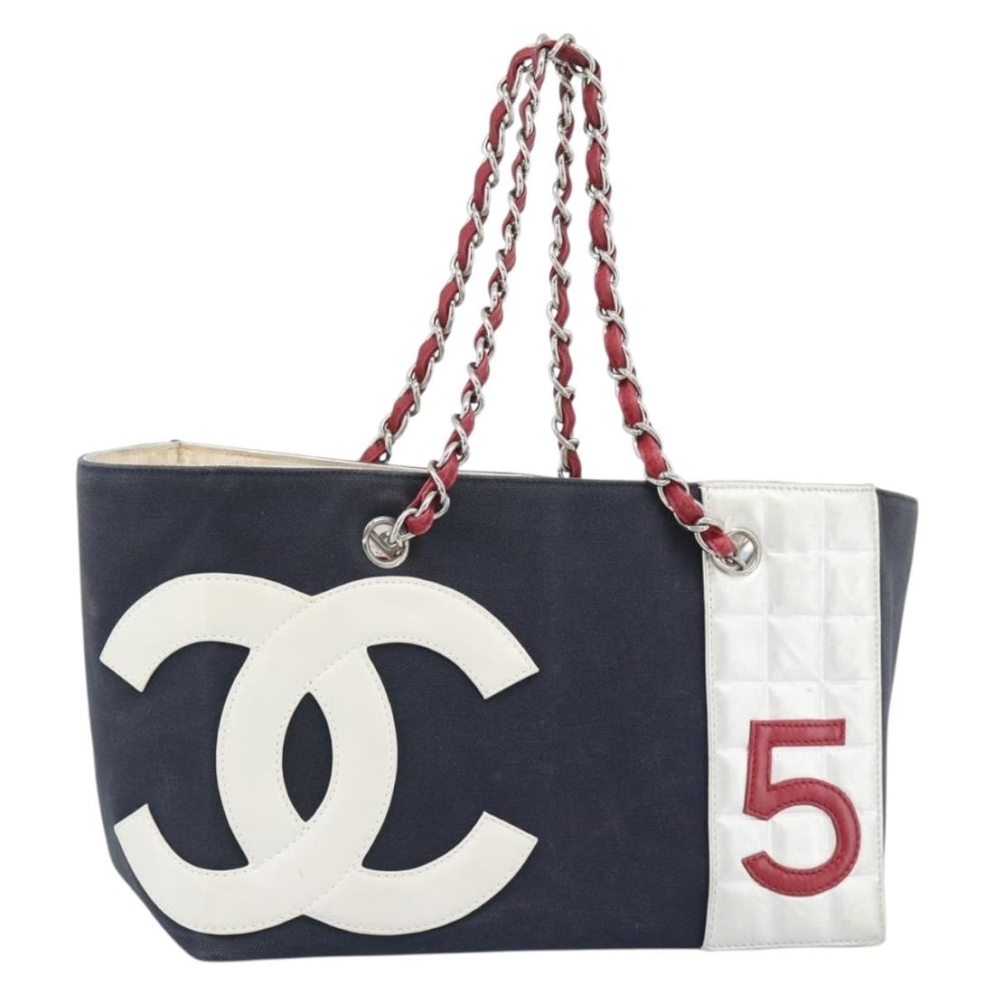 Chanel Choco Bar No 5 Canvas Chain Tote Navy Silver: Chanel Choco Bar No 5 Canvas Chain Tote Navy Silver Chanel Choco Bar Chain Tote Bag in navy and silver canvas. This tote bag is made in Italy and comes with a guarantee card. It features a handle drop