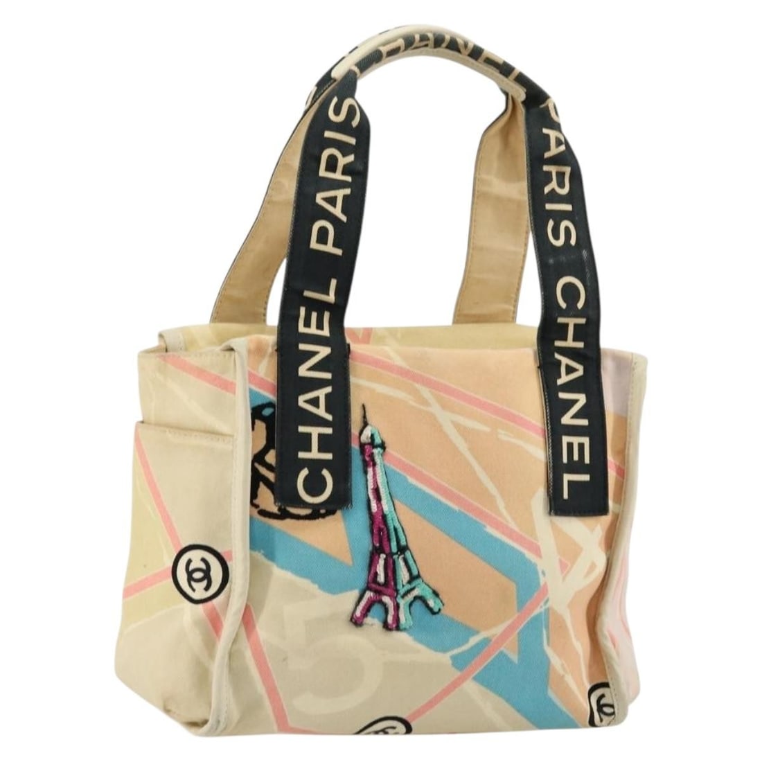 CHANEL beige canvas Cruise Line tote with silver CC accents: CHANEL beige canvas Cruise Line tote with silver CC accents This CHANEL Cruise Line hand bag is crafted from canvas in a beige and silver color combination. Made in France, it features a structured si