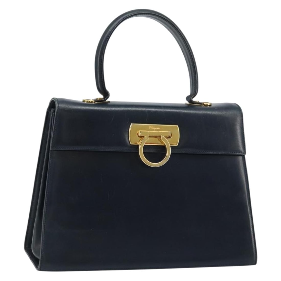 Navy Leather Gancini Handbag by Salvatore Ferragamo Gold Accents: Navy Leather Gancini Handbag by Salvatore Ferragamo Gold Accents This Salvatore Ferragamo Gancini handbag is crafted from navy leather with gold-tone accents. Designed for women, it features a structu