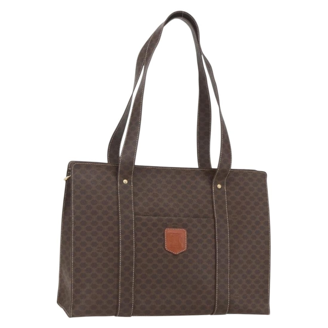 CELINE Macadam Brown PVC Canvas Tote with Leather Trim Gold Accents: CELINE Macadam Brown PVC Canvas Tote with Leather Trim Gold Accents This CELINE Macadam tote bag features brown and gold PVC leather with signature Macadam canvas detailing. The bag is made in Italy a