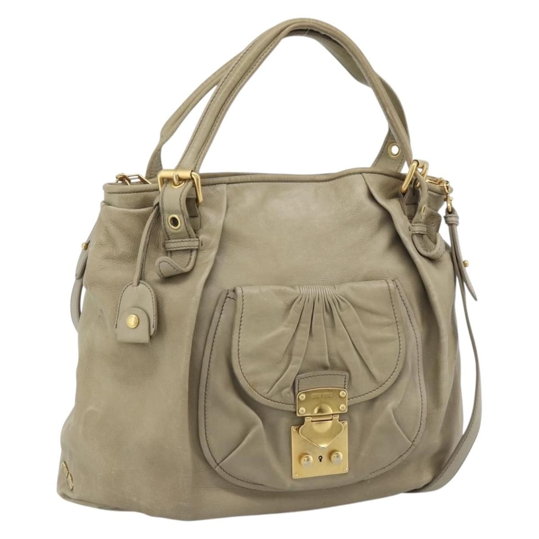 Miu Miu 2way Leather Tote Bag Beige with Shoulder Strap: Miu Miu 2way Leather Tote Bag Beige with Shoulder Strap This Miu Miu tote bag is crafted from leather in a beige and gold color combination. It features a 2-way design and comes with a shoulder strap 