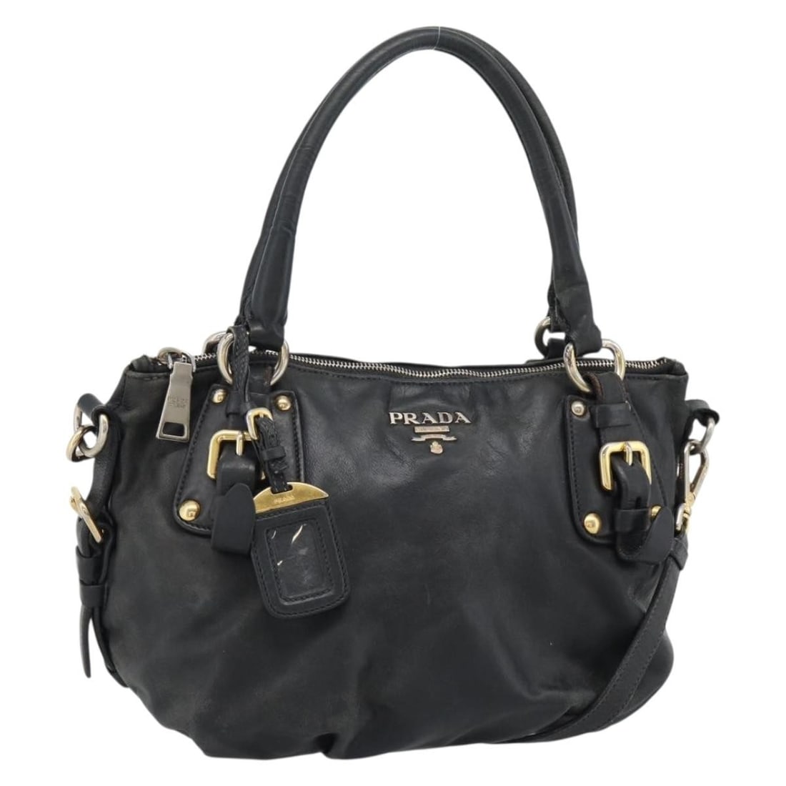 Prada Black Leather 2way Handbag with Shoulder Strap and Name Tag: Prada Black Leather 2way Handbag with Shoulder Strap and Name Tag Prada black and gold leather handbag in a 2-way style, made in Italy. It comes with a name tag and shoulder strap. The bag is describe