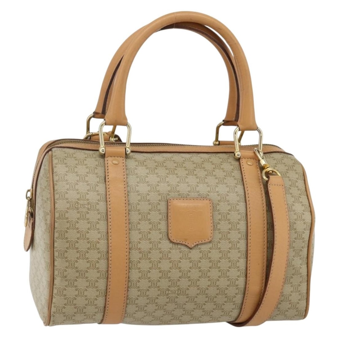 CELINE Macadam 2way Boston Bag in Beige PVC Leather: CELINE Macadam 2way Boston Bag in Beige PVC Leather Celine Macadam canvas 2-way Boston bag in beige and gold-tone with PVC leather trim. This women's bag includes a shoulder strap and can be carried b