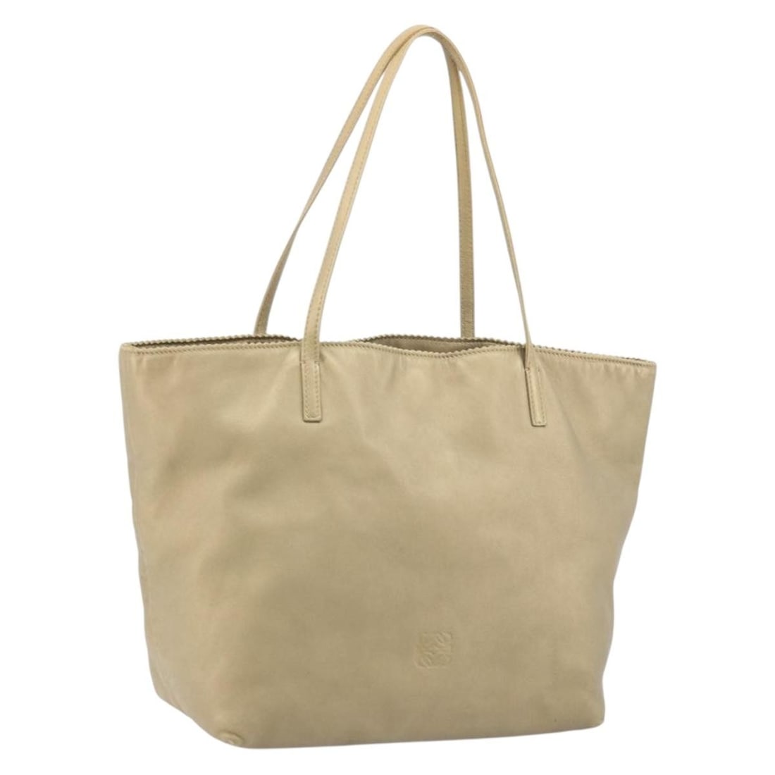 Gold Tone Leather Tote by LOEWE Spain: Gold Tone Leather Tote by LOEWE Spain This LOEWE tote bag features gold tone leather and is crafted in Spain. The bag has a structured silhouette with dual top handles and offers ample space for daily