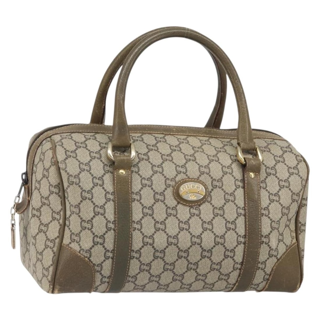 Beige GG Supreme Boston Bag by Gucci in PVC Leather: Beige GG Supreme Boston Bag by Gucci in PVC Leather This is a Gucci GG Plus Supreme Boston Bag crafted from beige and gold PVC leather with GG canvas accents. Designed for women, this bag features a s