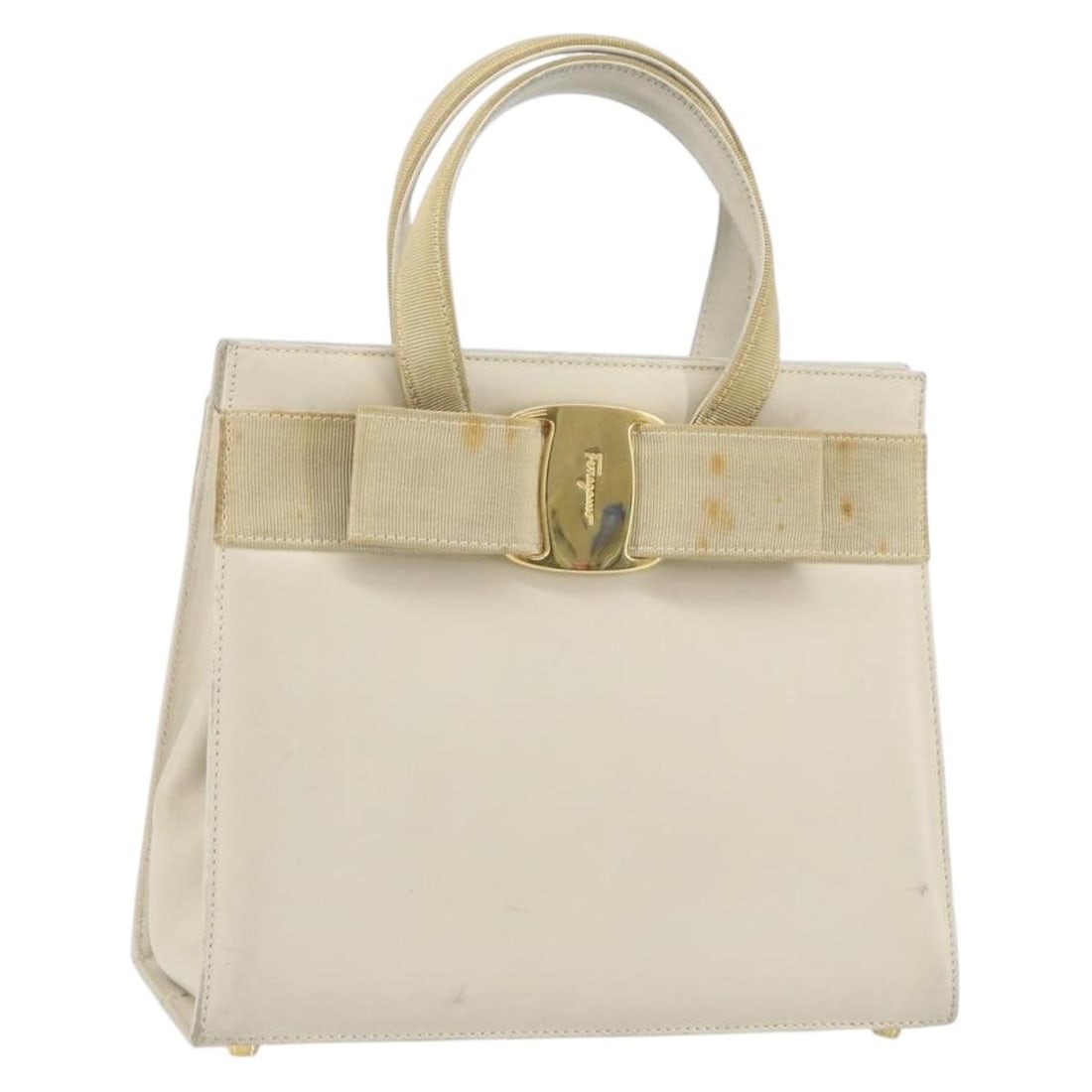 White Leather Vala Handbag by Salvatore Ferragamo Gold Accents: White Leather Vala Handbag by Salvatore Ferragamo Gold Accents This Salvatore Ferragamo Vala handbag features a white and gold leather exterior with gold-tone accents. Made in Italy, the bag is design