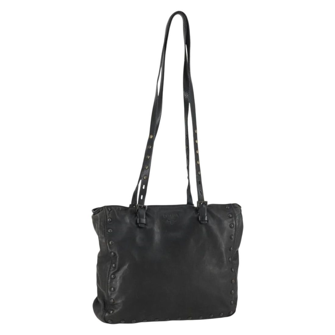 Black Leather PRADA Tote with Silver Stud Details Made in Italy: Black Leather PRADA Tote with Silver Stud Details Made in Italy This PRADA tote bag is crafted in black leather with silver-tone accents and features stud details. Made in Italy, it offers a spacious 