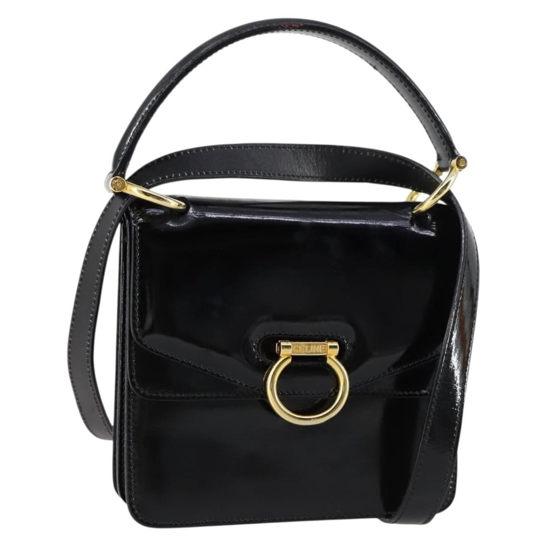 Celine Enamel Black Gold 2way Handbag with Shoulder Strap: Celine Enamel Black Gold 2way Handbag with Shoulder Strap This CELINE handbag features a two-way design crafted from black enamel with gold accents. The bag includes a matching shoulder strap for vers