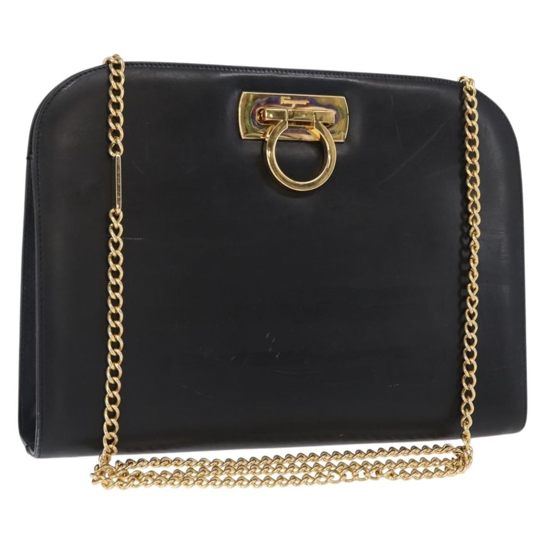 Black Leather Shoulder Bag with Gold Gancini Chain by Salvatore Ferragamo: Black Leather Shoulder Bag with Gold Gancini Chain by Salvatore Ferragamo This Salvatore Ferragamo Gancini Chain Shoulder Bag features a black leather exterior with gold-tone hardware. Designed as a s