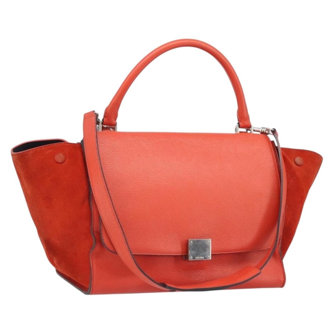 CELINE Trapeze Leather 2way Handbag Red with Shoulder Strap: CELINE Trapeze Leather 2way Handbag Red with Shoulder Strap CELINE Trapeze Hand Bag in leather with a red and silver exterior. This 2-way style includes a shoulder strap and is made in Italy. The bag 