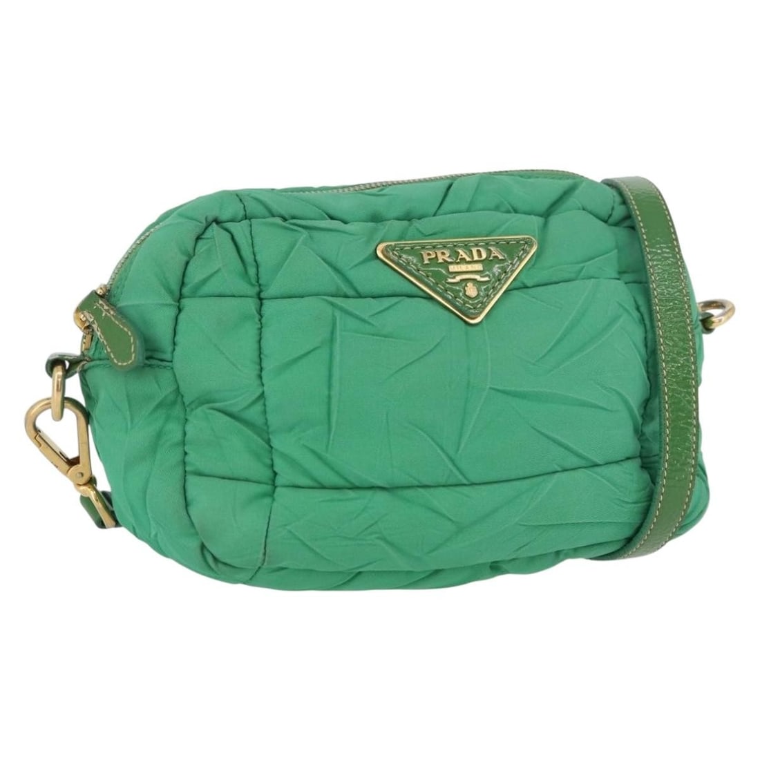 Prada Green Nylon Shoulder Bag with Gold Accents for Women: Prada Green Nylon Shoulder Bag with Gold Accents for Women This PRADA shoulder bag is crafted from green nylon with gold accents. Designed for women, it features a compact silhouette with an adjustabl
