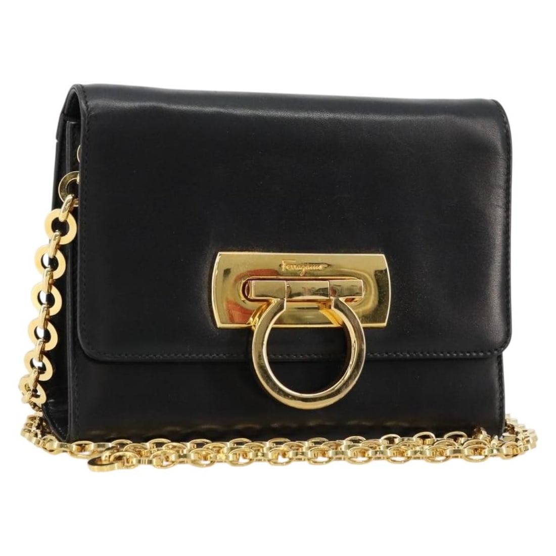 Black Leather Shoulder Bag Salvatore Ferragamo Gancini Chain Italy: Black Leather Shoulder Bag Salvatore Ferragamo Gancini Chain Italy Salvatore Ferragamo Gancini Chain Shoulder Bag in leather, presented in black and gold. Made in Italy, this women's shoulder bag feat