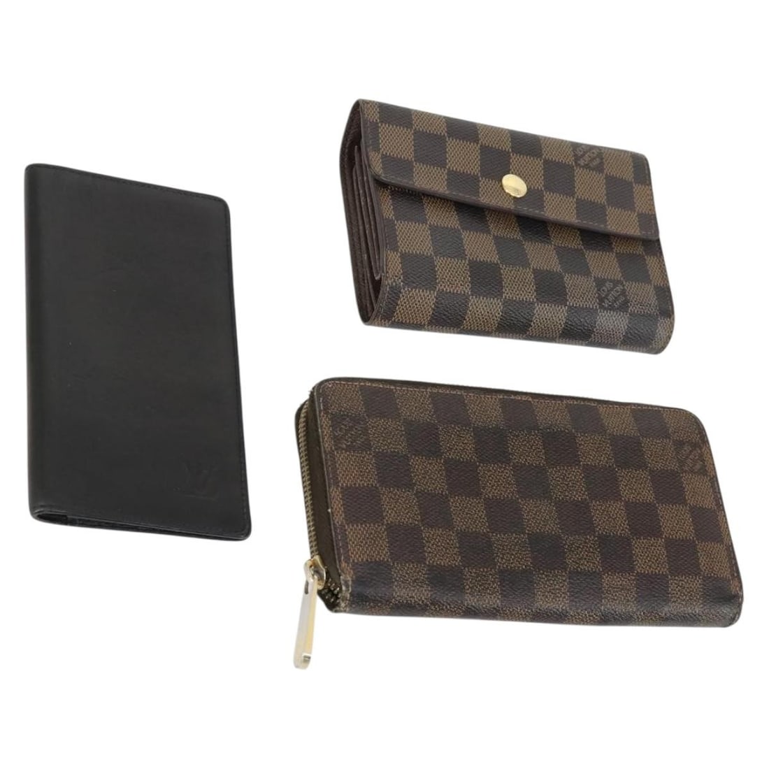 Set of 3 Louis Vuitton Damier Ebene Canvas Wallets: Set of 3 Louis Vuitton Damier Ebene Canvas Wallets Louis Vuitton Damier Ebene wallet set in Damier Ebene canvas. This item is a wallet and is described as a 3 set. It is ranked C and shows heavy use, 