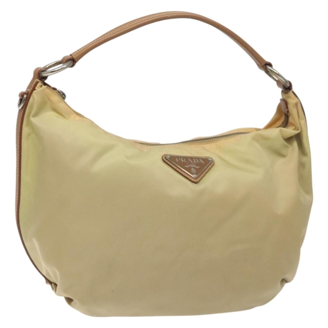 PRADA Beige Nylon Shoulder Bag with Silver Tone Leather Trim: PRADA Beige Nylon Shoulder Bag with Silver Tone Leather Trim Authentic Prada shoulder bag in beige nylon with silver-tone accents. This women's bag is made in Italy and features a slim profile with a 