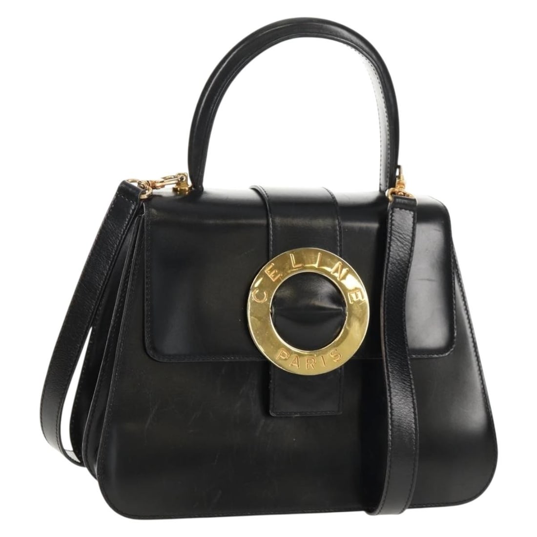 CELINE Circle 2way Leather Handbag Black with Strap and Dust Bag: CELINE Circle 2way Leather Handbag Black with Strap and Dust Bag CELINE circle hand bag in black and gold leather, made in Italy. This 2-way women's hand bag comes with a shoulder strap and dust bag. 