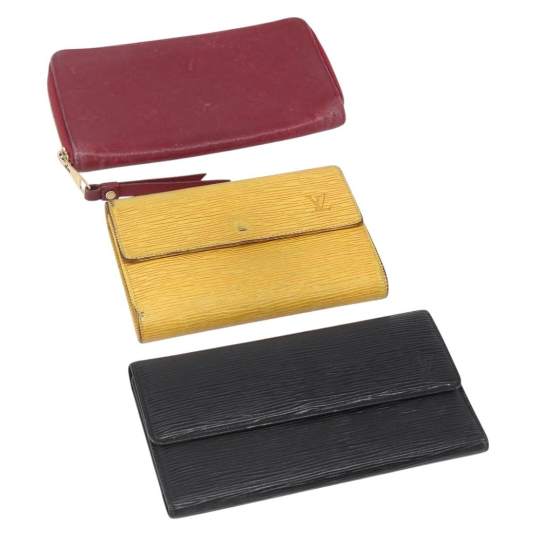 Louis Vuitton Monogram Canvas Wallet Trio in Black Yellow and Fuchsia: Louis Vuitton Monogram Canvas Wallet Trio in Black Yellow and Fuchsia This Louis Vuitton Empreinte Epi wallet set includes three wallets in black, yellow, and fuchsia with monogram canvas material. De