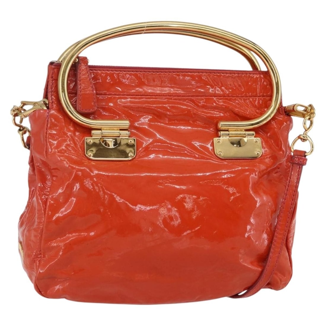 Miu Miu Orange Gold Enamel Hand Bag 2way Authentic: Miu Miu Orange Gold Enamel Hand Bag 2way Authentic This stylish Miu Miu Hand Bag showcases a vibrant orange enamel exterior complemented by gold accents. Designed for versatility, it features both a s