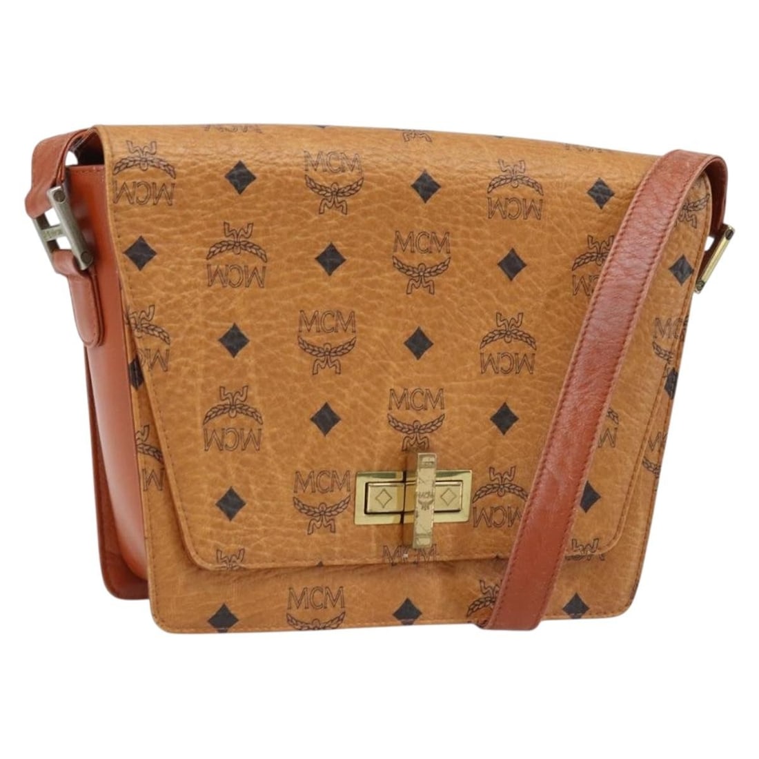 MCM Brown PVC Leather Shoulder Bag with Gold Accents Germany: MCM Brown PVC Leather Shoulder Bag with Gold Accents Germany This MCM Vicetos Logogram shoulder bag features a brown and gold PVC leather exterior with a classic logo print. Designed for women, the ba