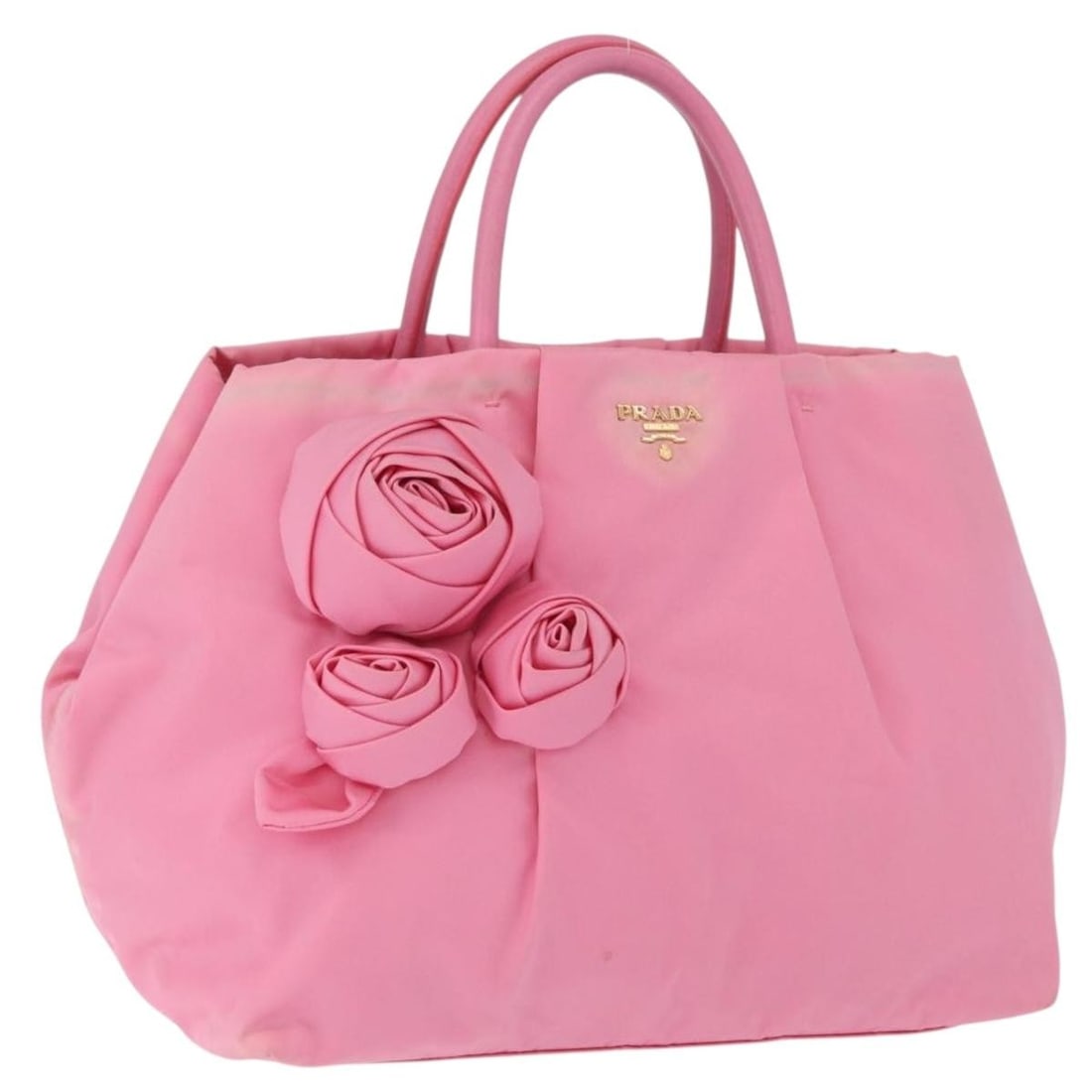 Prada Pink Nylon Hand Bag Gold Tone Made in Italy: Prada Pink Nylon Hand Bag Gold Tone Made in Italy Pink and gold Prada nylon handbag made in Italy. The bag measures approximately 27 cm wide, 22 cm high, and 14 cm deep, with a handle drop of approxim