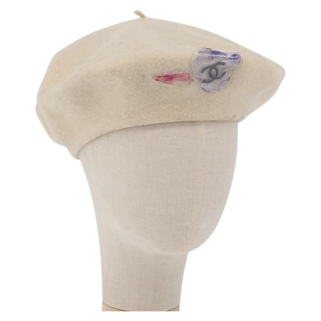 Ivory Wool CHANEL Women Hat: Ivory Wool CHANEL Women Hat This CHANEL women's hat is crafted from ivory wool and features the iconic CC logo. Made in France, it is designed for a head circumference of approximately 47 cm (18.5 inc