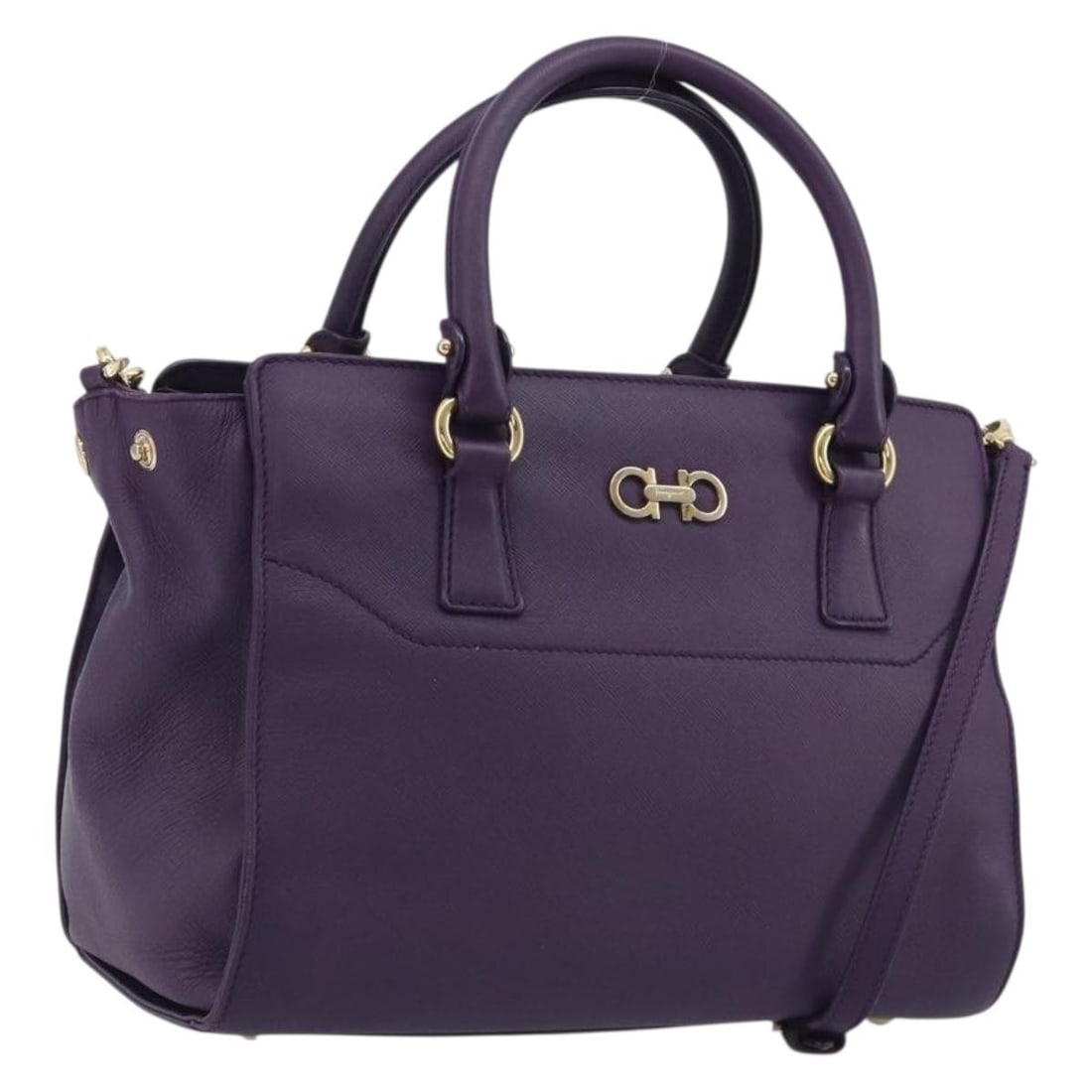Salvatore Ferragamo Gancini Purple Leather 2way Handbag Italy: Salvatore Ferragamo Gancini Purple Leather 2way Handbag Italy Salvatore Ferragamo Gancini leather 2-way handbag in purple with gold-tone accents. Made in Italy, this item is listed as a heavily used p