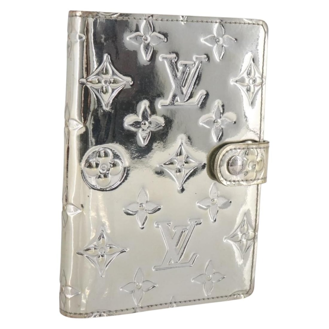 Louis Vuitton Monogram Miroir Silver Day Planner Cover R20963: Louis Vuitton Monogram Miroir Silver Day Planner Cover R20963 This Louis Vuitton Monogram Miroir Agenda PM Day Planner Cover is crafted from enamel and Monogram Miroir canvas in a striking silver colo