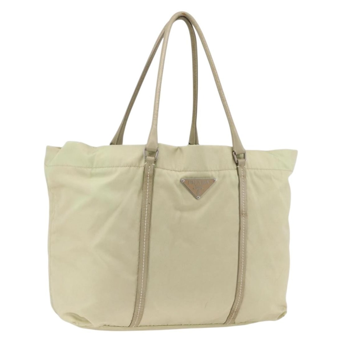 Prada nylon ivory silver women s tote bag Italy: Prada nylon ivory silver women s tote bag Italy This PRADA tote bag is crafted from ivory nylon with silver-tone accents, offering a spacious and practical design. Made in Italy, it features dual hand