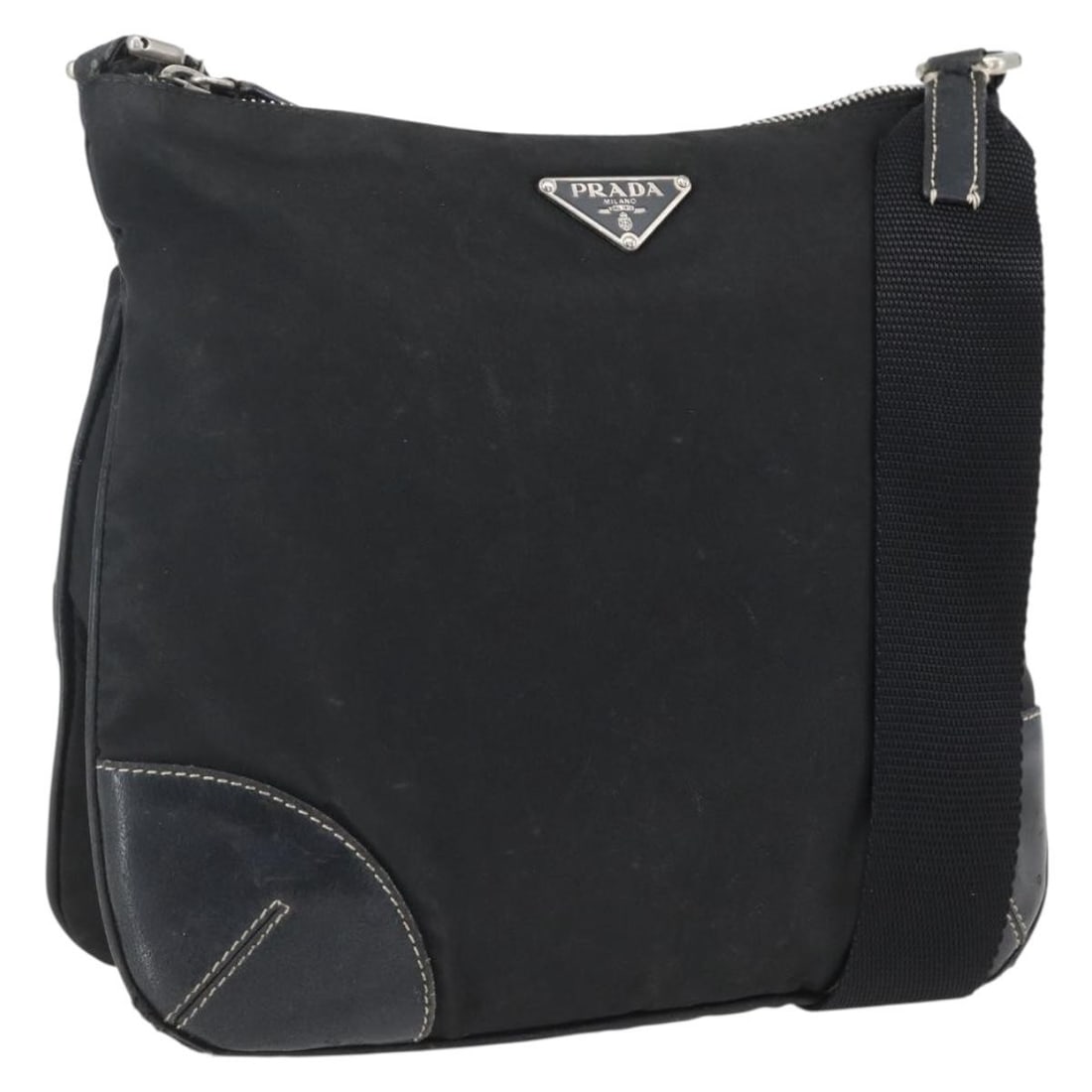 Black Nylon Shoulder Purse by Prada with Silver Accents: Black Nylon Shoulder Purse by Prada with Silver Accents This PRADA shoulder bag is crafted from black nylon with silver-tone accents and is designed for women. The bag features a shoulder strap with a