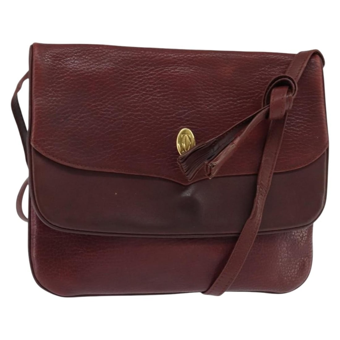 CARTIER Must Line Bordeaux Leather Shoulder Bag Gold Accents: CARTIER Must Line Bordeaux Leather Shoulder Bag Gold Accents This CARTIER Must Line Shoulder Bag is a stylish accessory crafted from high-quality leather in a striking bordeaux and gold color combinat