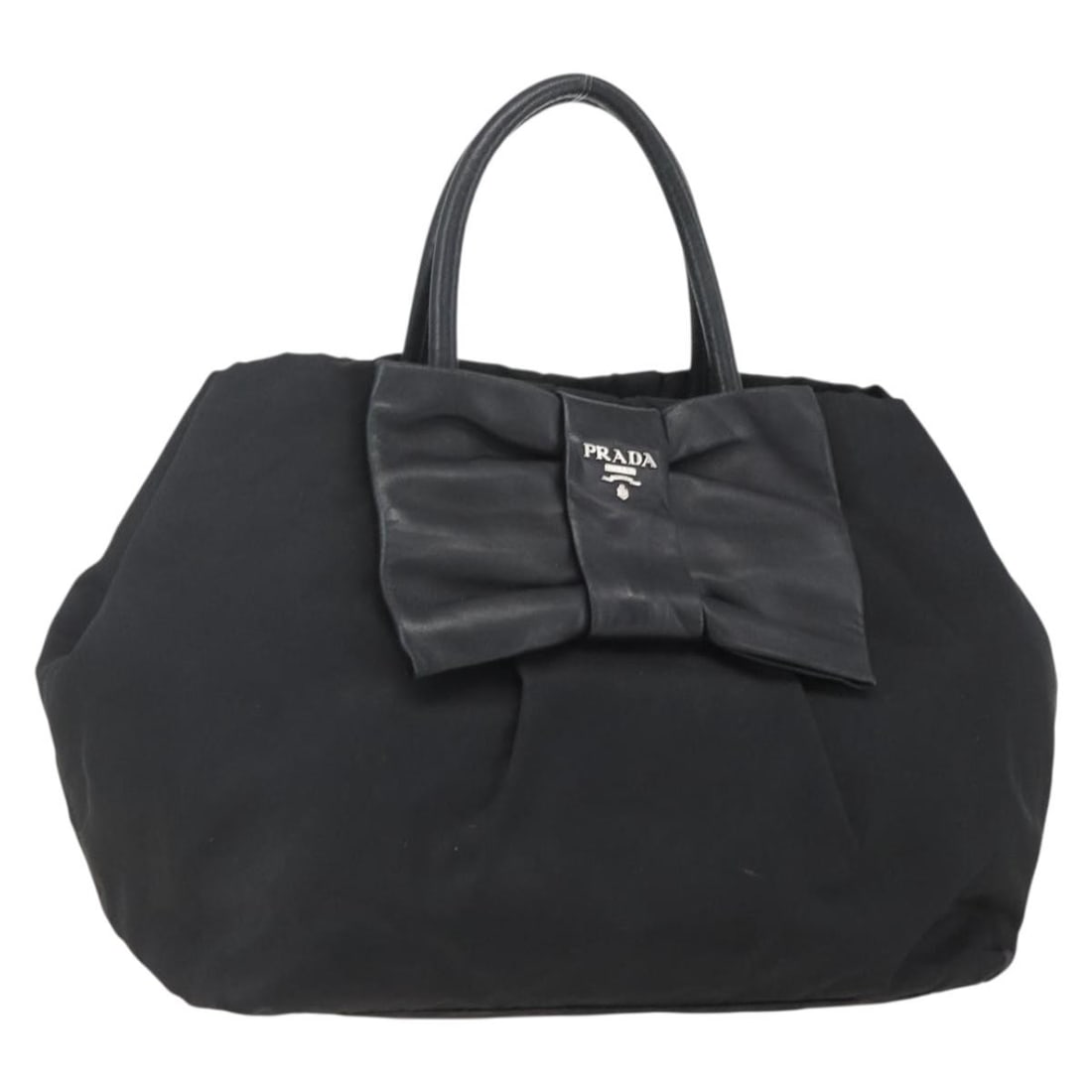 Prada black nylon women s handbag Italy silver trim: Prada black nylon women s handbag Italy silver trim This PRADA Ribbon Hand Bag is crafted from black nylon with silver-tone accents. Designed for women, the handbag features a spacious interior and pr