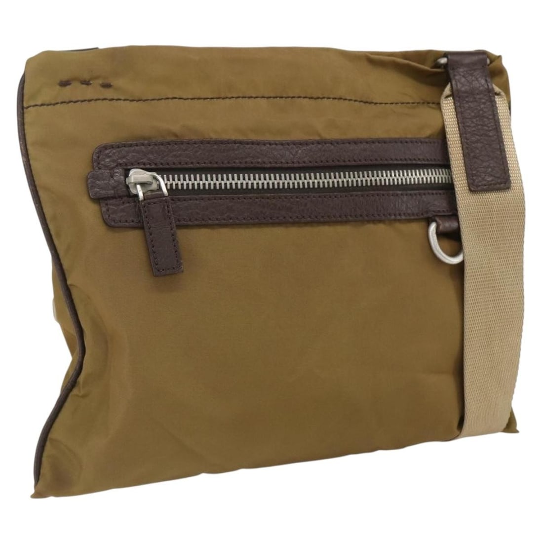 Beige Nylon Shoulder Purse by PRADA with Silver Accents Italy: Beige Nylon Shoulder Purse by PRADA with Silver Accents Italy This PRADA shoulder bag features a beige and silver nylon exterior, offering a lightweight and functional design. Made in Italy, it is equ