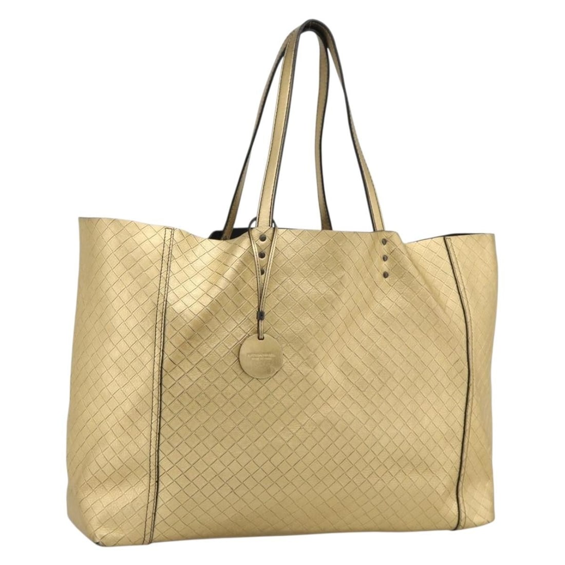 Bottega Veneta Intrecciato Leather Tote Bag Gold with Charm: Bottega Veneta Intrecciato Leather Tote Bag Gold with Charm Bottega Veneta Intrecciato tote bag in gold leather, made in Italy. It comes with a charm accessory and features a handle drop of approximat