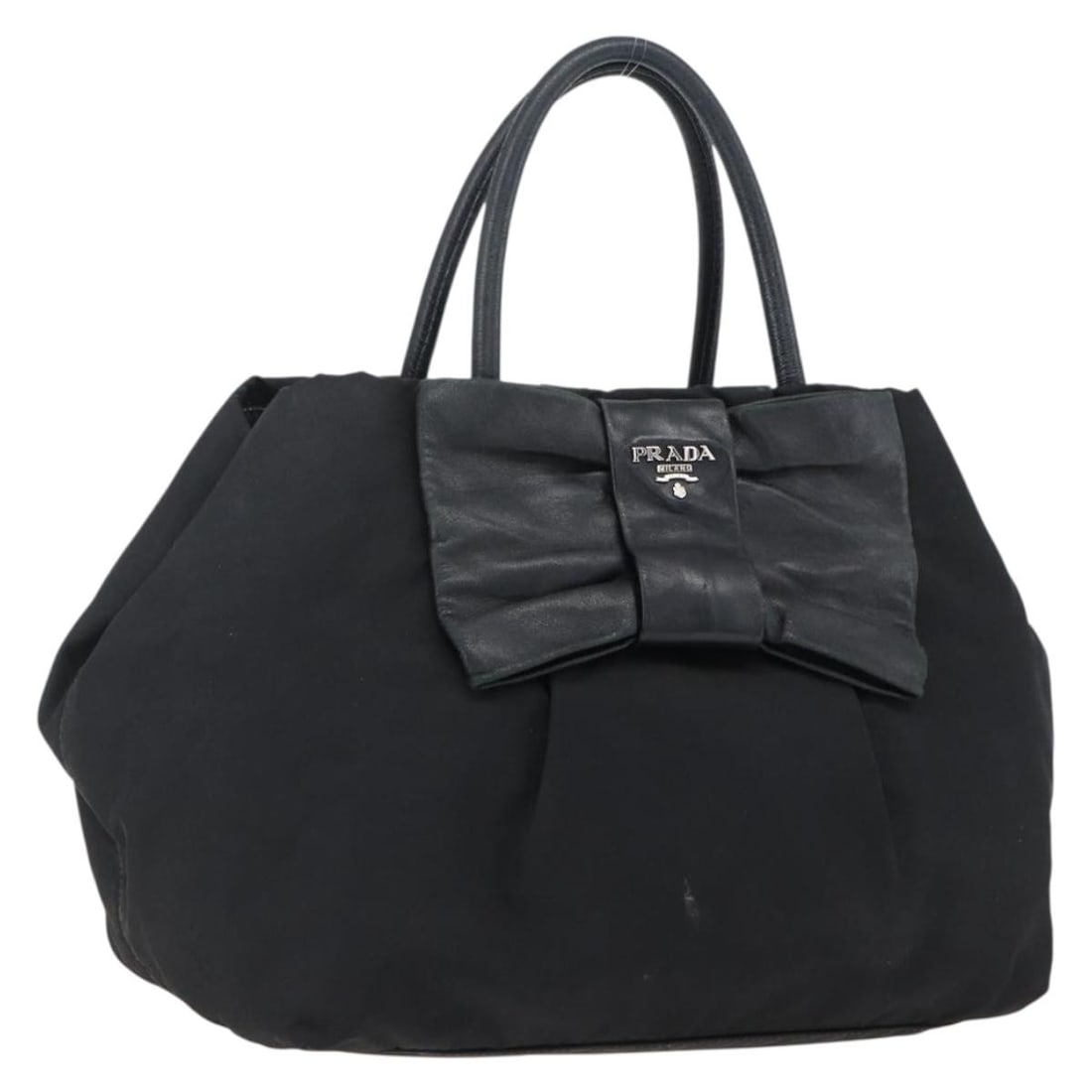Prada black nylon leather ribbon handbag auth Italy: Prada black nylon leather ribbon handbag auth Italy This PRADA Ribbon Hand Bag features a black and silver color scheme and is crafted from nylon with leather accents. Designed for women, it offers a 