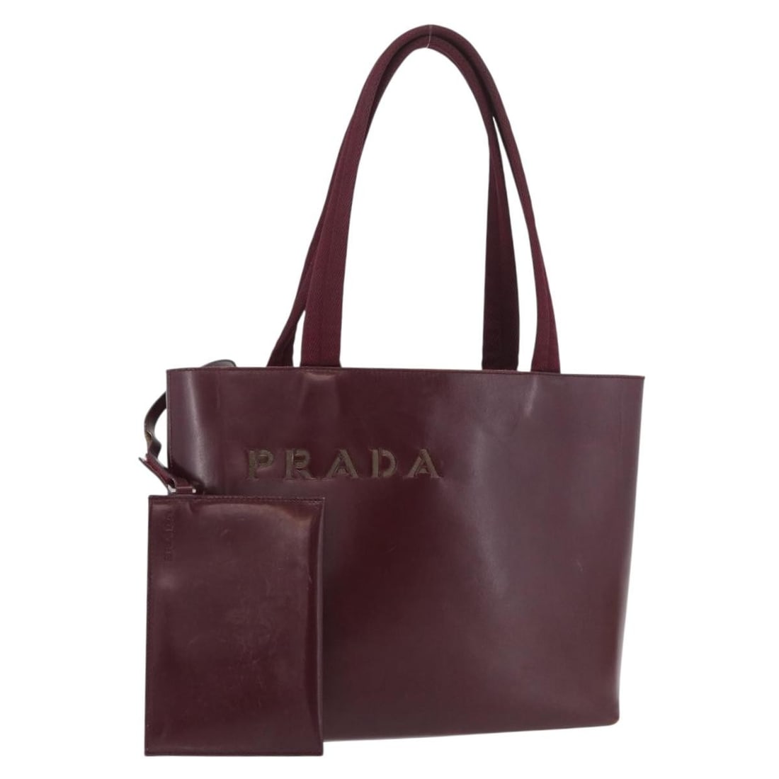 Prada Bordeaux Leather Tote with Pouch Italy: Prada Bordeaux Leather Tote with Pouch Italy This PRADA tote bag is crafted from leather in a Bordeaux and silver color scheme. Designed for women, it features a spacious interior and comes with a pou
