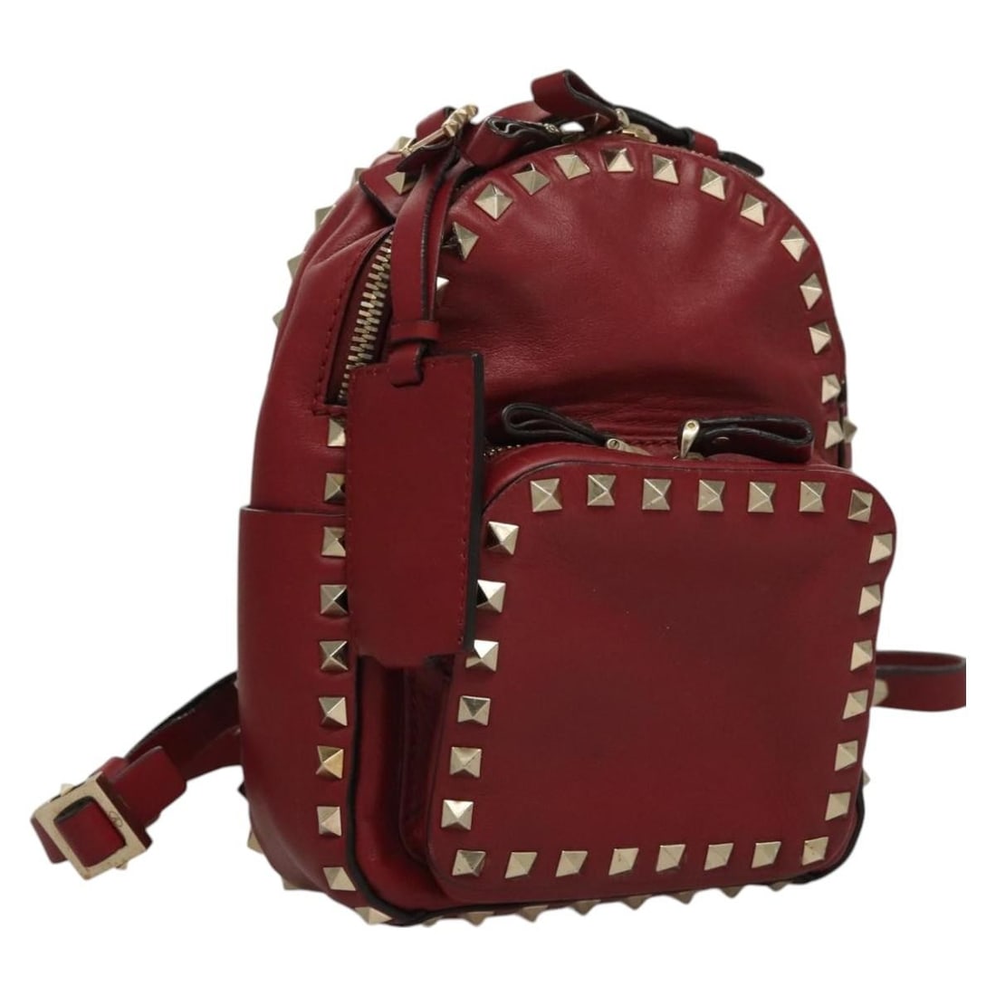 Red Leather Valentino Backpack for Women Made in Italy: Red Leather Valentino Backpack for Women Made in Italy This Valentino women's backpack features a red leather exterior and is crafted in Italy. The bag shows signs of heavy use, including rubbing, scr