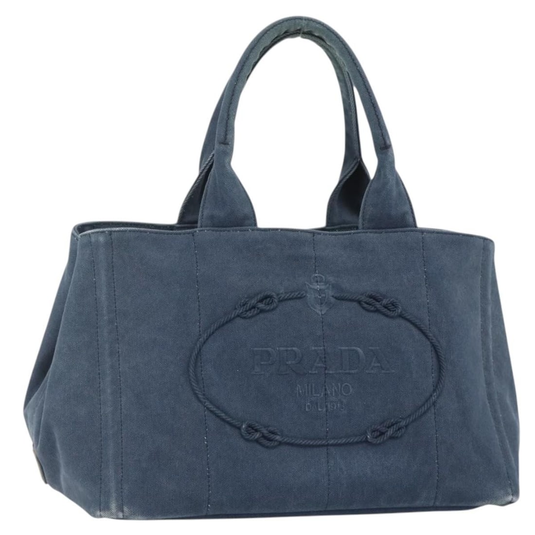 Prada Canapa navy canvas tote handbag Italy gold trim: Prada Canapa navy canvas tote handbag Italy gold trim This PRADA Canapa M handbag is crafted from navy and gold canvas, offering a stylish and practical accessory for everyday use. Made in Italy, it f