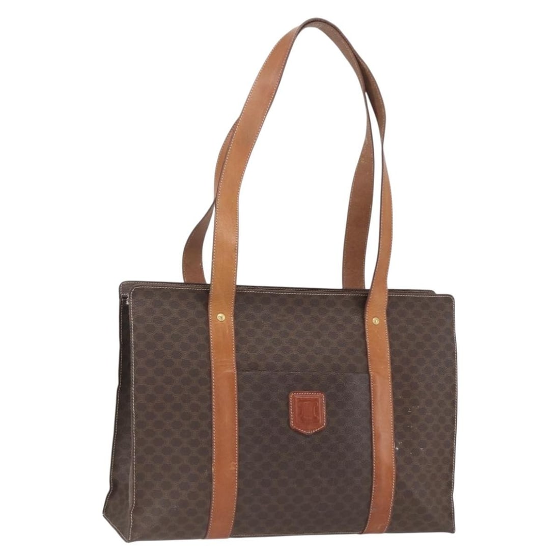Celine Brown Macadam Canvas PVC Leather Tote Bag Gold-Tone Accents: Celine Brown Macadam Canvas PVC Leather Tote Bag Gold-Tone Accents This CELINE Macadam Canvas tote bag is crafted from PVC leather in a brown and gold color scheme. Made in Italy, it features the icon