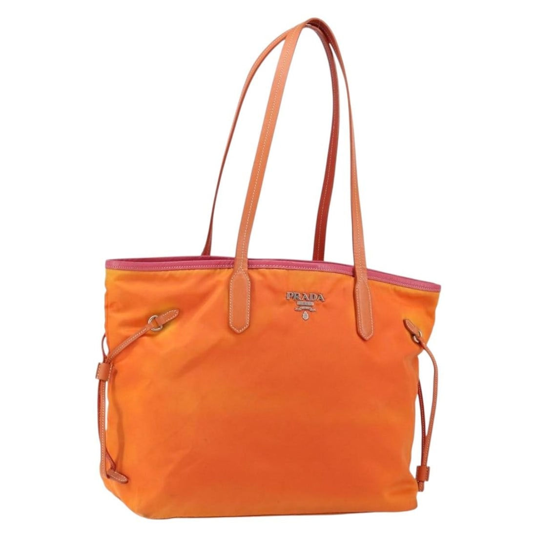 Prada orange nylon women tote bag Italy silver accents: Prada orange nylon women tote bag Italy silver accents This PRADA tote bag is crafted from durable nylon in a striking orange and silver color scheme. Designed for women, the bag features spacious dim