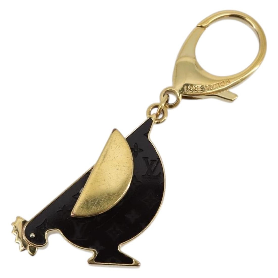 Louis Vuitton Animalia Chicken Metal Bag Charm: Louis Vuitton Animalia Chicken Metal Bag Charm This LOUIS VUITTON Animalia Chicken Charm is crafted from metal in dark brown and gold tones. Designed as a stylish accessory, it features a whimsical ch