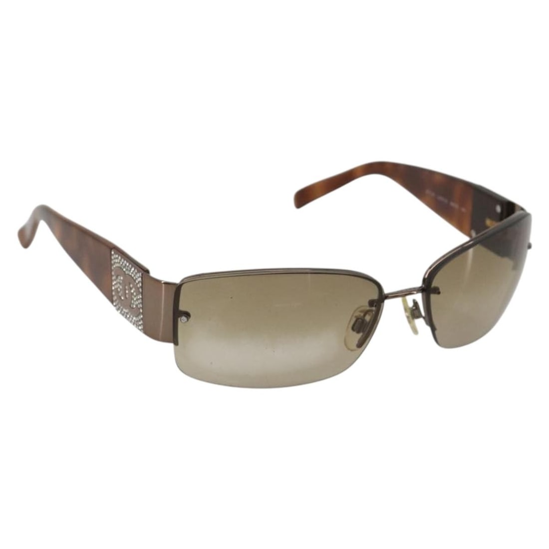 Plastic Brown Silver Sunglasses CHANEL CC with Case: Plastic Brown Silver Sunglasses CHANEL CC with Case CHANEL sunglasses in brown and silver plastic, made in Italy. The item comes with a sunglass case and shows signs of heavy use, including slight sur